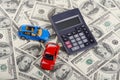 Car toys and calculator through dollars