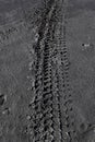 The car tracks on the ground. Tyre track on dirt sand or mud