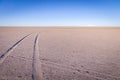 Car tracks on salt lake at Salar de Uyuni, Bolivia Royalty Free Stock Photo