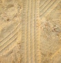 Car tracks in sand layer Royalty Free Stock Photo