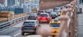 Car traffic entering a city bridge, business concept Royalty Free Stock Photo