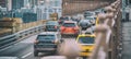 Car traffic entering a city bridge, business concept Royalty Free Stock Photo