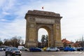 Car traffic, heavy city traffic at The Arch of Triumph junction Arcul de Triumf in Bucharest, Romania, 2020