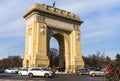 Car traffic, heavy city traffic at The Arch of Triumph junction Arcul de Triumf in Bucharest, Romania, 2020