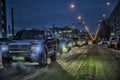 Car traffic at night on the street in winter Royalty Free Stock Photo