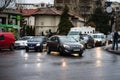 Car traffic at rush hour on the main boulevard in Bucharest downtown. Rainy morning, rainy evening during winter in Bucharest,