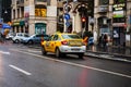 Car traffic at rush hour on the main boulevard in Bucharest downtown. Rainy morning, rainy evening during winter in Bucharest,