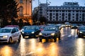 Car traffic at rush hour on the main boulevard in Bucharest downtown. Rainy morning, rainy evening during winter in Bucharest,