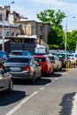 Car traffic at rush hour stopped at red light. Car pollution, traffic jam in the morning and evening in the capital city of