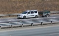 Car with the trailer goes on highway Royalty Free Stock Photo