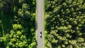 car with trailer moving on road in summer forest, drone dolly shot Royalty Free Stock Photo