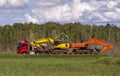 Car trailer with two crawler excavators on a long platform. Royalty Free Stock Photo