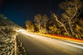 Car trails on road at night in sierra mountains california Royalty Free Stock Photo