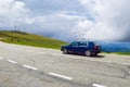 Car on the Transalpina serpentines road DN67C. This is one of the most beautiful alpine routes in Romania