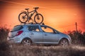 Car is transporting bicycle on the roof Royalty Free Stock Photo