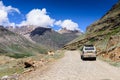 A car travel along the road on Manali-Leh highway in Ladakh, Himachal Pradesh, India