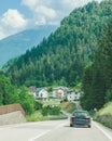 car travel road through small town in mountains Royalty Free Stock Photo