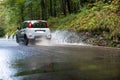 Car traveling in the flooded road Royalty Free Stock Photo