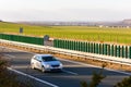 Car traveling on the highway at sunset Royalty Free Stock Photo