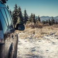 car for traveling with a winter mountain road Royalty Free Stock Photo