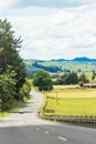 A car travelling along an open country road