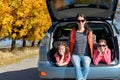 Car trip on autumn family vacation, happy mother and kids travel Royalty Free Stock Photo