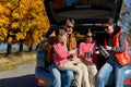 Car trip on autumn family vacation, happy parents and kids travel Royalty Free Stock Photo