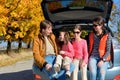 Car trip on autumn family vacation, happy parents and kids travel Royalty Free Stock Photo