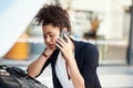 Car troubles will frustrate you in a minute. a frustrated young businesswoman calling roadside assistance after her car