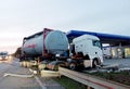 Car truck with fuel tank accident on gas station at night in dust. Dangerous car accident on road Royalty Free Stock Photo