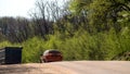 A car and a truck on a slope on a forest road. Back view. Royalty Free Stock Photo