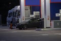 Car and trucks at a gas station Royalty Free Stock Photo