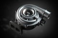 Car turbocharger on black background. Auto part turbo engine technology concept Royalty Free Stock Photo