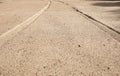 Car tyre tracks on the beach sand in perspective Royalty Free Stock Photo