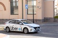 Car with Uber logo. Uber is American mobility as service provider. Its services include ride-hailing, delivery, couriers Royalty Free Stock Photo