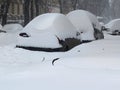 Car under snow, Natural disasters winter, blizzard, heavy snow paralyzed the city, collapse. Snow covered the cyclone Europe