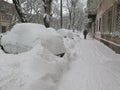 Car under snow, Natural disasters winter, blizzard, heavy snow paralyzed the city, collapse. Snow covered the cyclone Europe