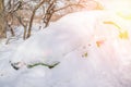 Car under a snowdrift. Winter Parking. Snow drifts in winter