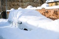 Car under a thick layer of snow after heavy snowfall Royalty Free Stock Photo