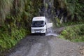 The car under the waterfall on the Death road, Yungas North Road between La Paz and Coroico, Bolivia