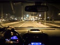 Car use on night road. man holding steering wheel in car Royalty Free Stock Photo