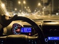 Car use on night road. man holding steering wheel in car Royalty Free Stock Photo