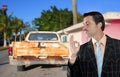 Car used salesperson selling old car as brand new Royalty Free Stock Photo