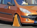 Car vehicle clamped wheel clamp illegal road park parking cars autos tax police notice