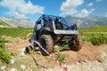 Car 4x4 off road climbing on the mountain at a car race in village theodoriana , arta perfecture , greece