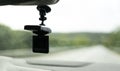 Car video camera dash cam inside of car on highway with blurred background of highway road, from perspective of the driver. Conc Royalty Free Stock Photo