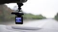 Car video camera dash cam inside of car on highway with blurred background of highway road, from perspective of the driver. Conc Royalty Free Stock Photo