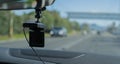 Car video camera dash cam inside of car on highway with blurred background of highway road, from perspective of the driver. Conc Royalty Free Stock Photo