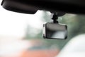 Car video recorder installed on front window, close up photo Royalty Free Stock Photo