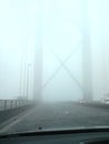 Car view of driving over the forth road bridge during a foggy day Royalty Free Stock Photo